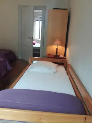 Un ou plusieurs lits dans un hébergement de l'établissement Gite au sein du Parc des Volcans d'Auvergne, tous commerces à pied