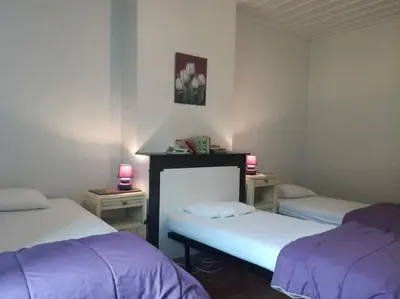 Un ou plusieurs lits dans un hébergement de l'établissement Gite au sein du Parc des Volcans d'Auvergne, tous commerces à pied