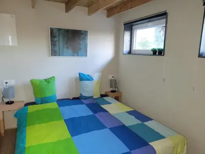 Un ou plusieurs lits dans un hébergement de l'établissement Petite maison vue sur Lac de la Triouzoune Neuvic