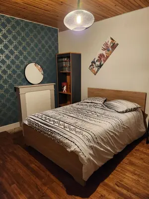 Un ou plusieurs lits dans un hébergement de l'établissement La chambre d'Antoine