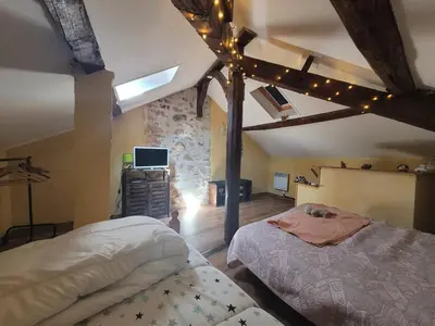 Un ou plusieurs lits dans un hébergement de l'établissement Maison dans un havre de paix
