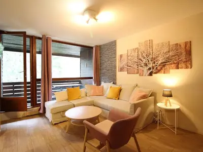Coin salon dans l'établissement Duplex au Mont-Dore avec parking, proche centre et pistes - FR-1-608-268