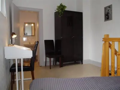 Un ou plusieurs lits dans un hébergement de l'établissement Appart-Hôtel Limoges
