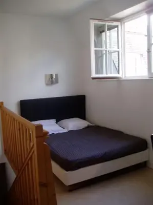 Un ou plusieurs lits dans un hébergement de l'établissement Appart-Hôtel Limoges