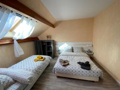 Un ou plusieurs lits dans un hébergement de l'établissement Entre Vulcania et le Sancy