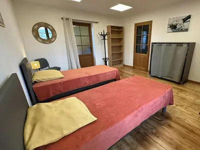 Un ou plusieurs lits dans un hébergement de l'établissement La murette