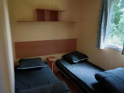 Un ou plusieurs lits dans un hébergement de l'établissement Camping la Vallée