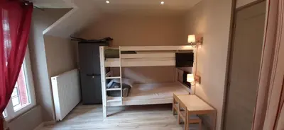 Un ou plusieurs lits dans un hébergement de l'établissement Appartement au cœur du Mont-Dore