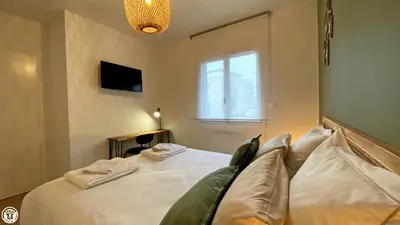 Un ou plusieurs lits dans un hébergement de l'établissement Appart 'Hôtel BreakIsleBed Limoges CHU & Fac Médecine Pharma à Pied parking gratuit