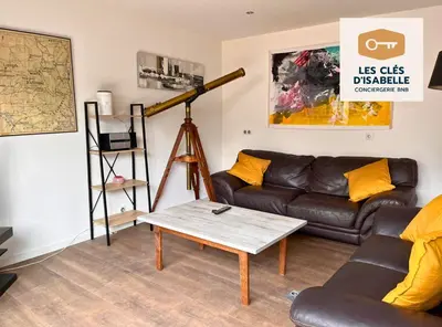 Coin salon dans l'établissement Appartement climatisé avec sa terrasse de 25 M2