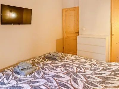Un ou plusieurs lits dans un hébergement de l'établissement Chalet les Estives au pied des pistes, le lioran, terrasse, 2 chambres, 4 lits