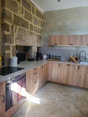 Cuisine ou kitchenette dans l'établissement Les Dépendances du Château