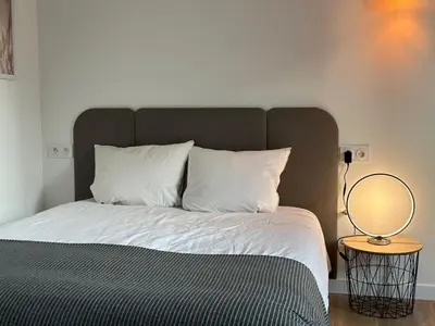 Un ou plusieurs lits dans un hébergement de l'établissement Studio moderne/rue Encombe Vineuse- DABNB