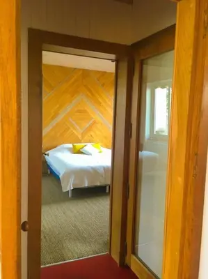 Un ou plusieurs lits dans un hébergement de l'établissement Maison centre hyper calme au vert