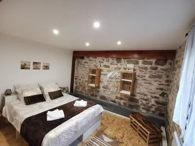 Un ou plusieurs lits dans un hébergement de l'établissement Gîte Corrézien 3 pers. Piscine chauffée