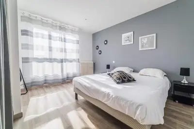 Un ou plusieurs lits dans un hébergement de l'établissement Le Balcon - 2 Chambres