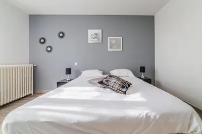 Un ou plusieurs lits dans un hébergement de l'établissement Le Balcon - 2 Chambres