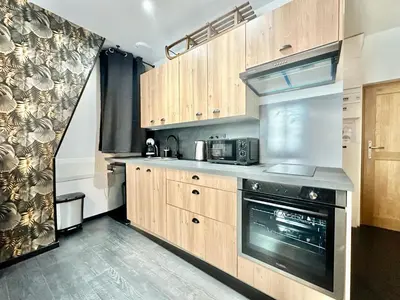Cuisine ou kitchenette dans l'établissement Le Chalet, central et calme
