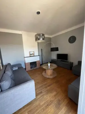 Coin salon dans l'établissement Maison au bord du lac