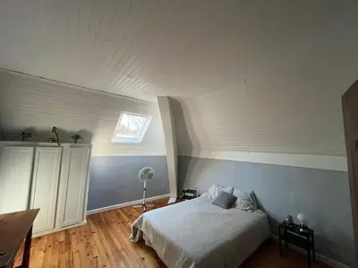 Un ou plusieurs lits dans un hébergement de l'établissement Maison au bord du lac
