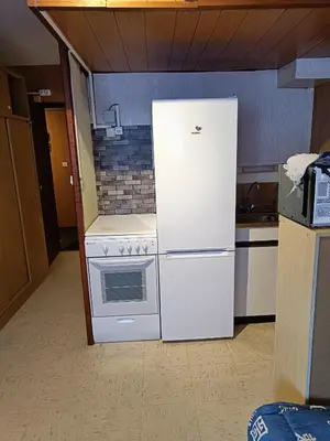 Cuisine ou kitchenette dans l'établissement Studio Mont dore proche funiculaire