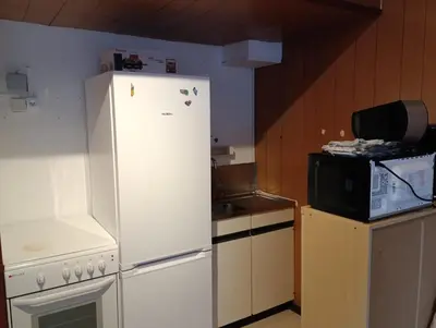 Cuisine ou kitchenette dans l'établissement Studio Mont dore proche funiculaire