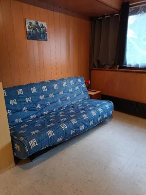 Coin salon dans l'établissement Studio Mont dore proche funiculaire