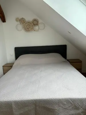 Un ou plusieurs lits dans un hébergement de l'établissement Charmant Appt Duplex - 8 Personnes