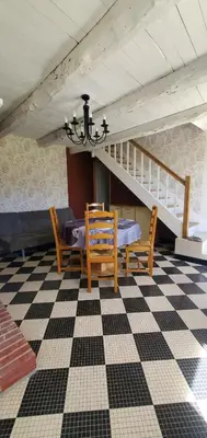 Coin salon dans l'établissement Location petite maison
