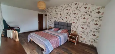 Un ou plusieurs lits dans un hébergement de l'établissement Location petite maison