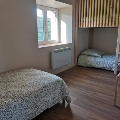 Un ou plusieurs lits dans un hébergement de l'établissement Gite L'estive du Clozel Le Salers