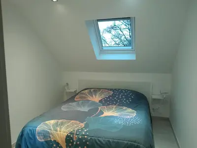 Un ou plusieurs lits dans un hébergement de l'établissement Gîte Theillac - Maison au calme avec beau jardin