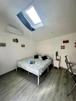 Un ou plusieurs lits dans un hébergement de l'établissement Casa 4 Saisons - Studio à thème - PiscineJardin - Proche centre-ville