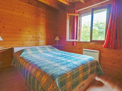 Un ou plusieurs lits dans un hébergement de l'établissement Chalet Cottage du Lac by Interhome
