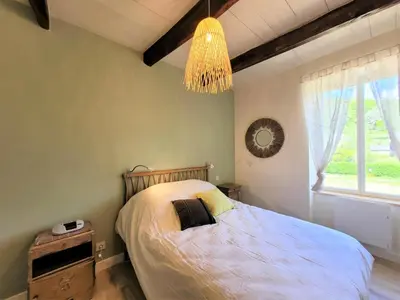 Un ou plusieurs lits dans un hébergement de l'établissement Gîte de France L'air du paradis 3 épis - Gîte de France 6 personnes MAE-6344