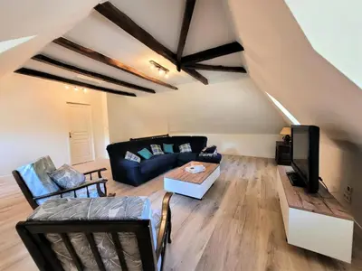 Coin salon dans l'établissement Gîte de France Le grand air du paradis 3 épis - Gîte de France 9 personnes MAE-6464