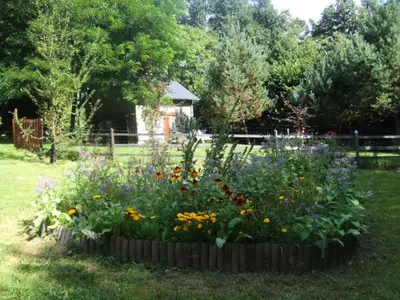 Jardin de l'établissement Gîte de France Le fournil 3 épis - Gîte de France 2 personnes MAE-5564