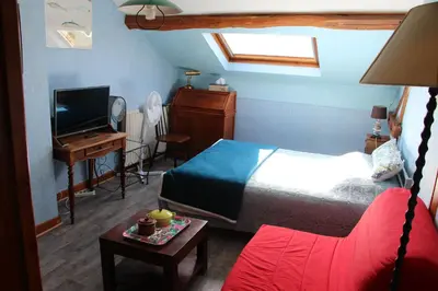 Un ou plusieurs lits dans un hébergement de l'établissement Chambre atypique chez l'habitant