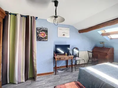 Un ou plusieurs lits dans un hébergement de l'établissement Chambre atypique chez l'habitant