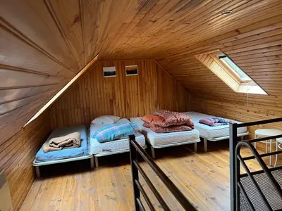 Un ou plusieurs lits dans un hébergement de l'établissement Maison au Giraldès Le Claux Puy Mary Volcan chalet