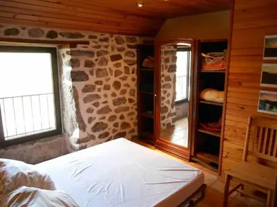 Un ou plusieurs lits dans un hébergement de l'établissement Maison au Giraldès Le Claux Puy Mary Volcan chalet