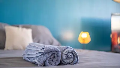 Un ou plusieurs lits dans un hébergement de l'établissement Bleu Paon - Welc'Home