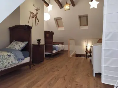 Un ou plusieurs lits dans un hébergement de l'établissement La Ramure, maison de village