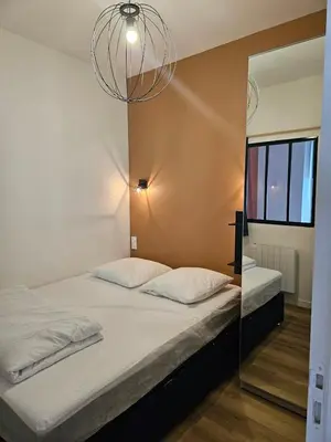 Un ou plusieurs lits dans un hébergement de l'établissement Appartements 4, 5 et 10 personnes rénovés en centre-ville
