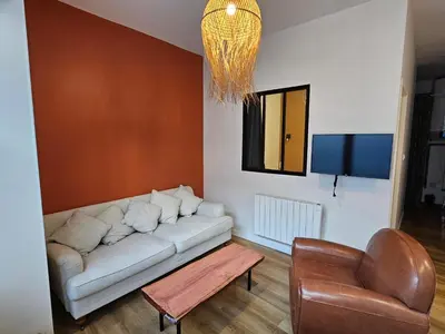 Coin salon dans l'établissement Appartements 4, 5 et 10 personnes rénovés en centre-ville