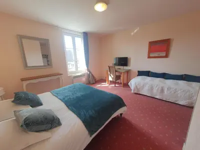 Un ou plusieurs lits dans un hébergement de l'établissement Hotel Auberge du Fin Chapon - Dordogne