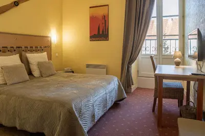 Un ou plusieurs lits dans un hébergement de l'établissement Hotel Auberge du Fin Chapon - Dordogne
