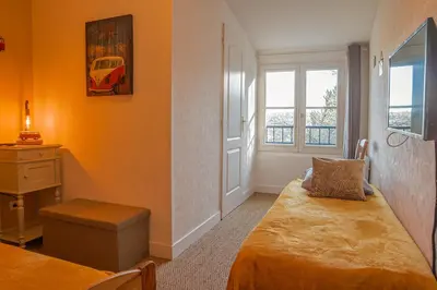 Un ou plusieurs lits dans un hébergement de l'établissement Hotel Auberge du Fin Chapon - Dordogne
