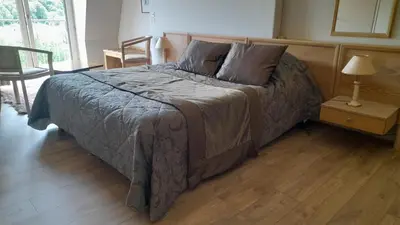 Un ou plusieurs lits dans un hébergement de l'établissement Chambre d'hôte la Maronne dans le Cantal