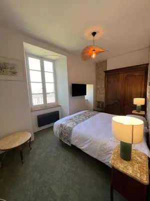 Un ou plusieurs lits dans un hébergement de l'établissement Château d'Aynac